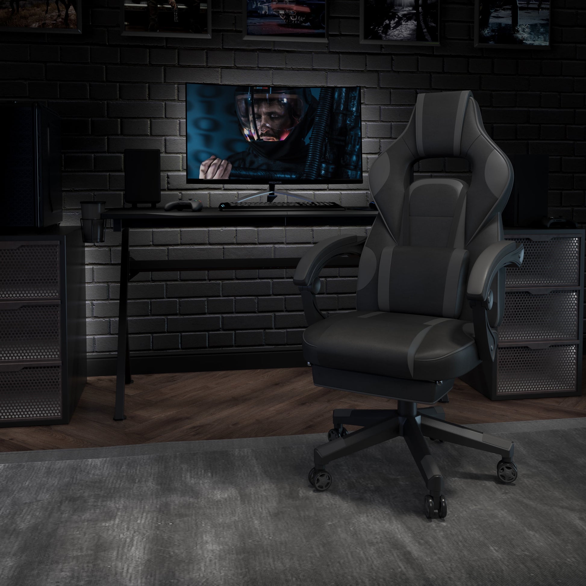 Ergonomic gaming chair in dark gray setup with desk, monitor, and PC for immersive gameplay