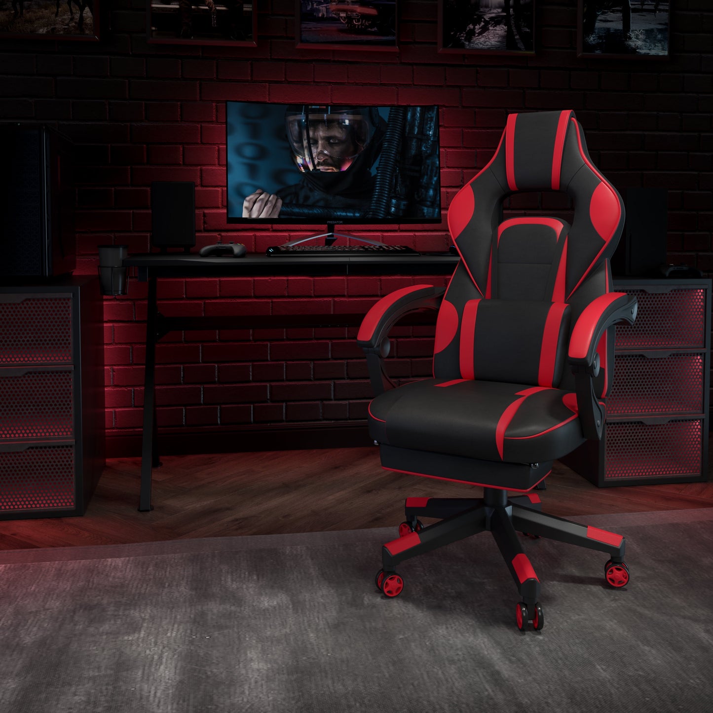 Black and red gaming chair in a retro 8-bit inspired setup with desk, monitor, and controller
