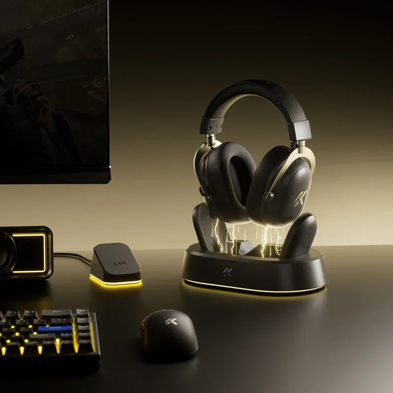 Gaming headset on LED-lit stand with wireless mouse, keyboard, and monitor in dark setup