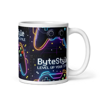 White ceramic mug with neon-style video game controllers and text ByteStyle Level Up Your Style