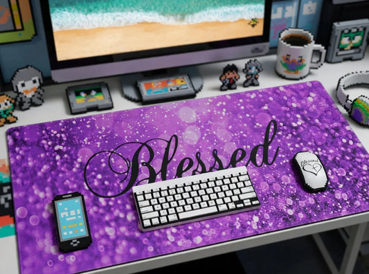 Retro gaming desk setup with pixel art accessories, purple 'Blessed' mouse pad, and mechanical keyboard