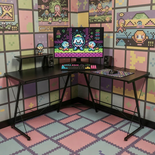 Retro gaming desk setup with black desk, RGB keyboard, mouse, monitor, and pixel art decor