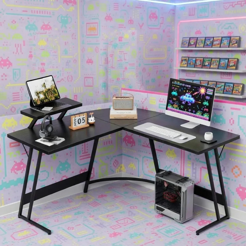 Retro gaming desk setup with PC, monitor, keyboard, headset, and pastel pixel art decor