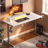 Modern white gaming desk with curved monitor, mechanical keyboard, mouse, and LED lighting in cozy room
