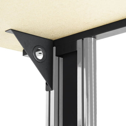 Black metal corner bracket securing wood tabletop to silver metal table leg with a circular hole detail