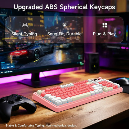 Retro pink ABS keycap keyboard on gaming desk with RGB lighting, controller, and PC monitor.