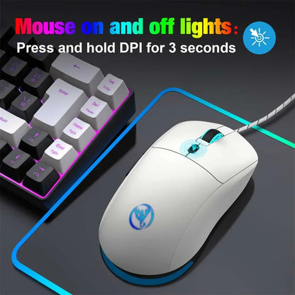 White gaming mouse with blue RGB lighting on mouse pad and keyboard with pink backlight