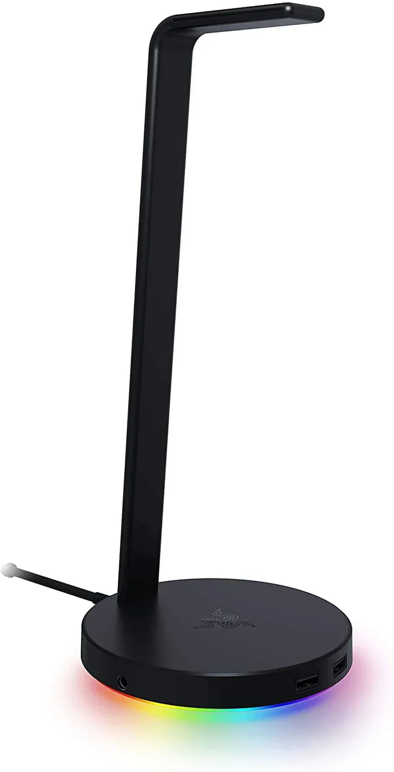 Black RGB gaming headset stand with USB ports and illuminated base on white background.