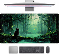 Gaming desk setup with widescreen mouse pad featuring silhouette of cat in mystical forest with glowing fireflies