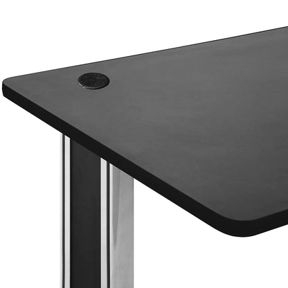 Close-up of black standing desk with rounded corner and polished metal legs