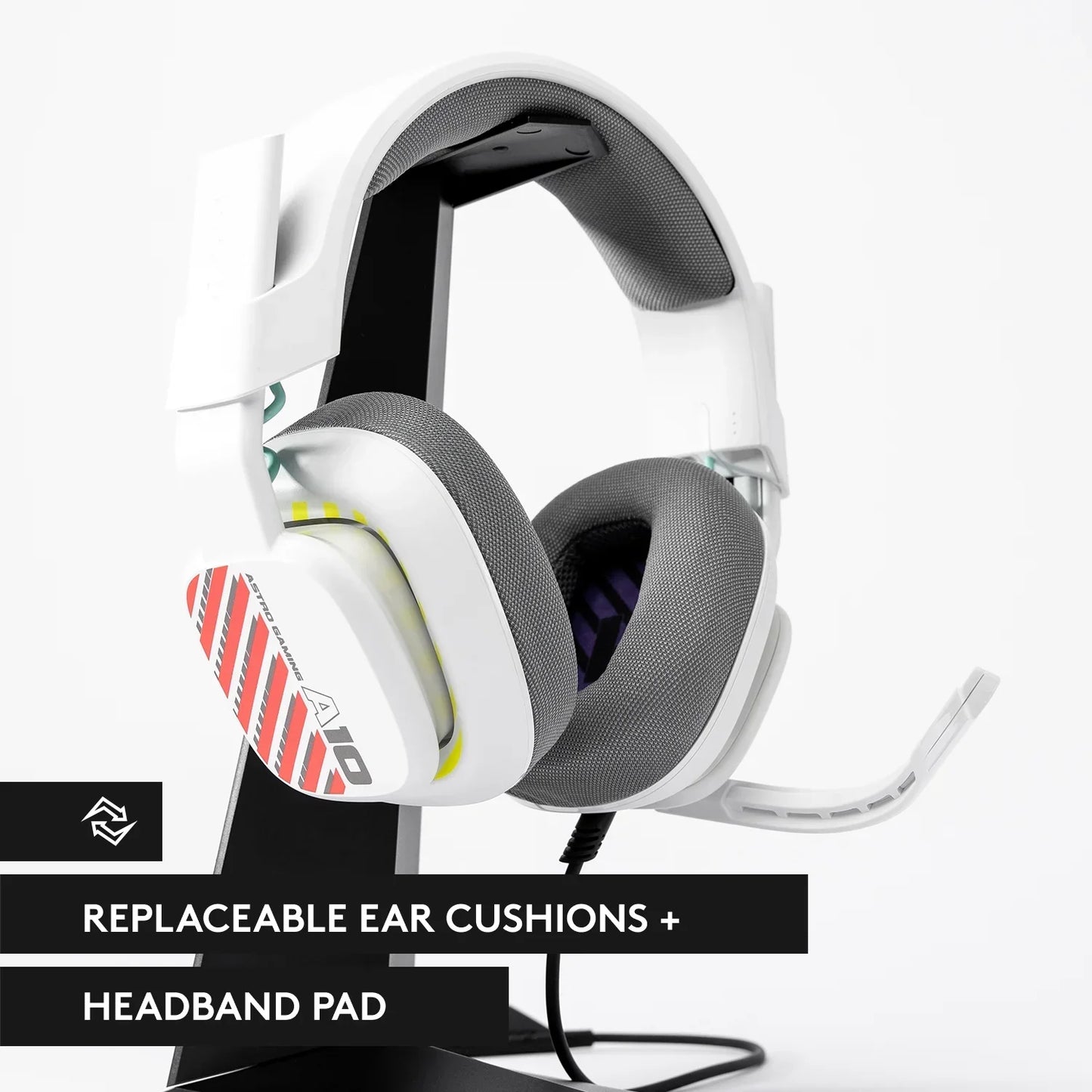 White Astro A10 gaming headset with replaceable ear cushions and headband pad on a black stand