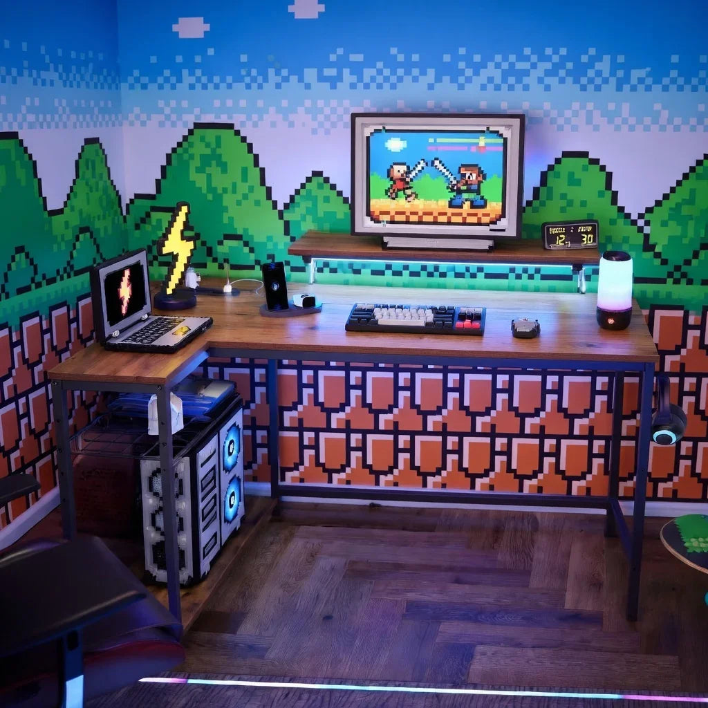 Retro 8-bit gaming setup with dual desks, pixel wall art, mechanical keyboard, and LED lights.