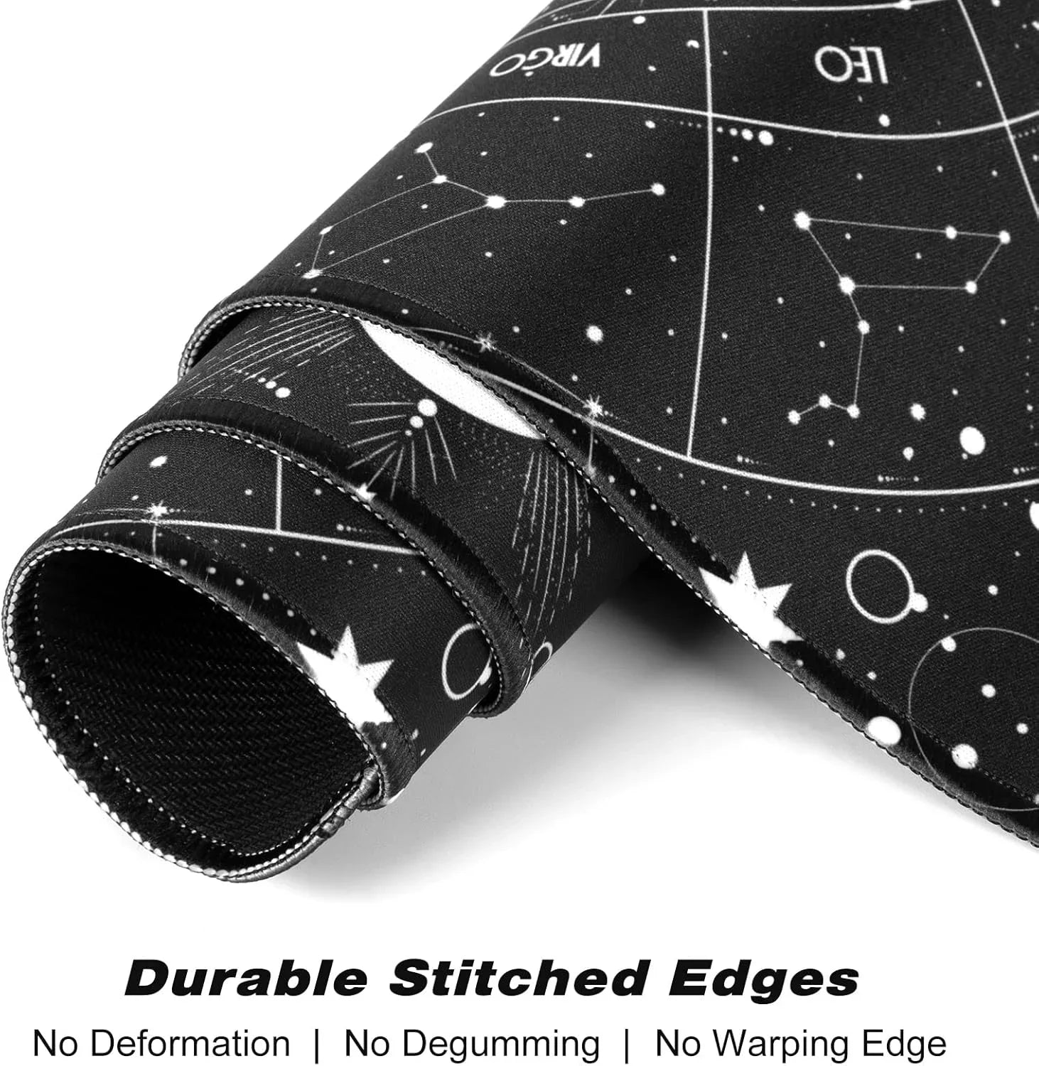 Rolled black gaming mouse pad with white constellation and zodiac designs featuring durable stitched edges