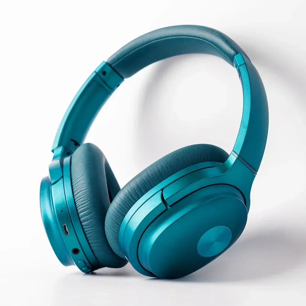 Teal over-ear wireless gaming headset with padded ear cups on white background