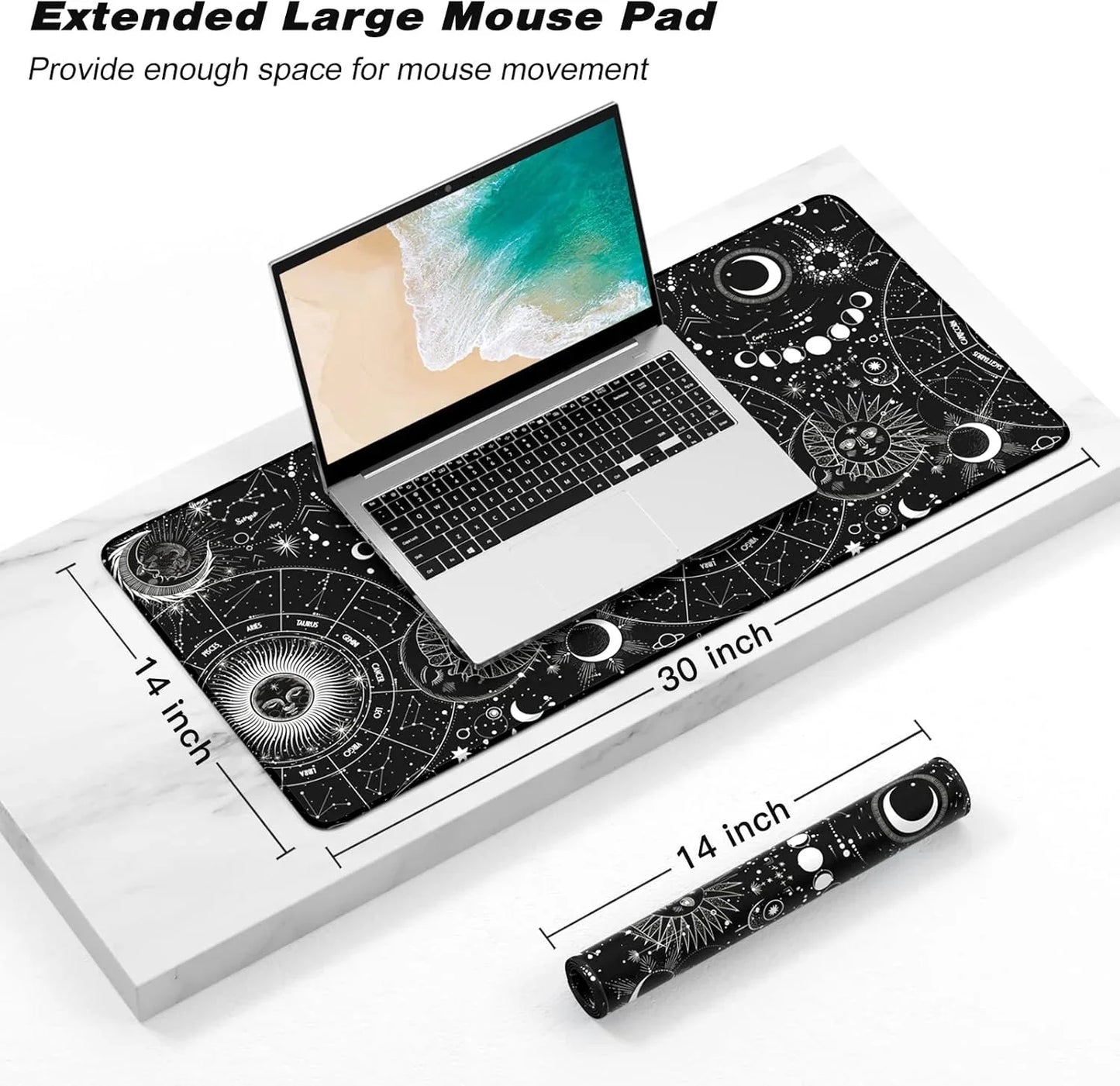 Extended large black mouse pad with celestial sun, moon, and constellation designs under silver laptop, 30x14 inch size