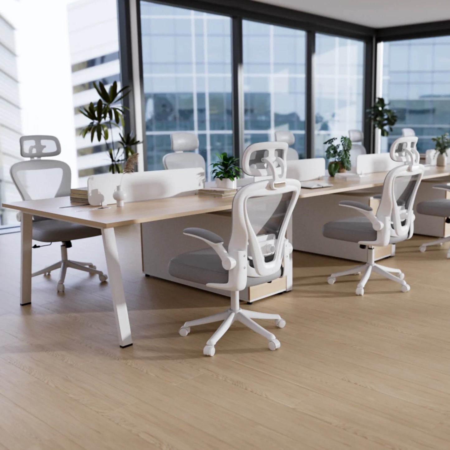 Modern ergonomic office chairs at sleek desks in bright workspace with large windows