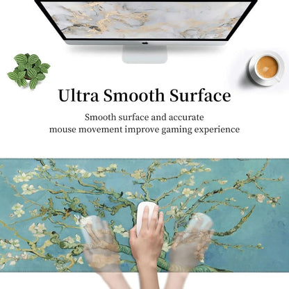 Gaming mouse on floral blue ultra smooth surface mouse pad with computer, plant, and coffee cup