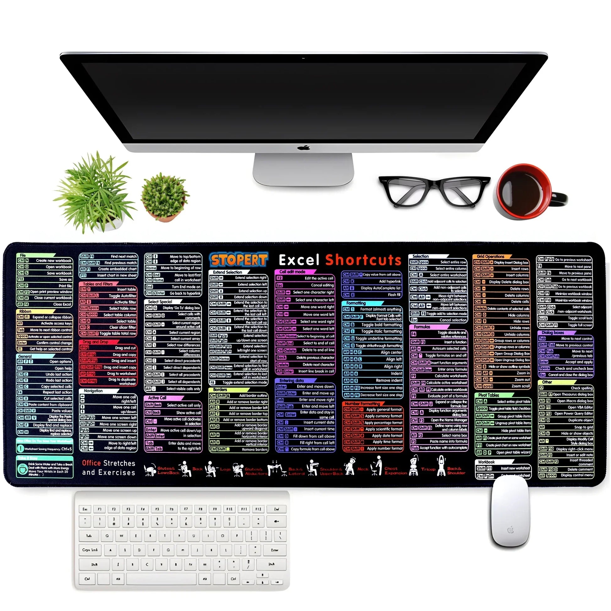 Top view of a modern workspace with an iMac, white keyboard and mouse, glasses, coffee cup, two small plants, and a large desk mat displaying colorful Excel shortcuts and office stretches