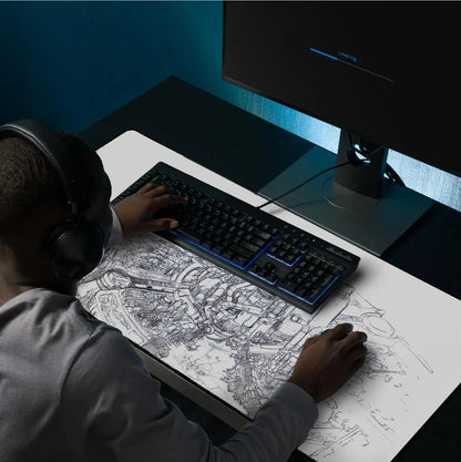 Gamer wearing headphones at desk with mechanical keyboard and mouse on futuristic cityscape mouse pad, monitor loading
