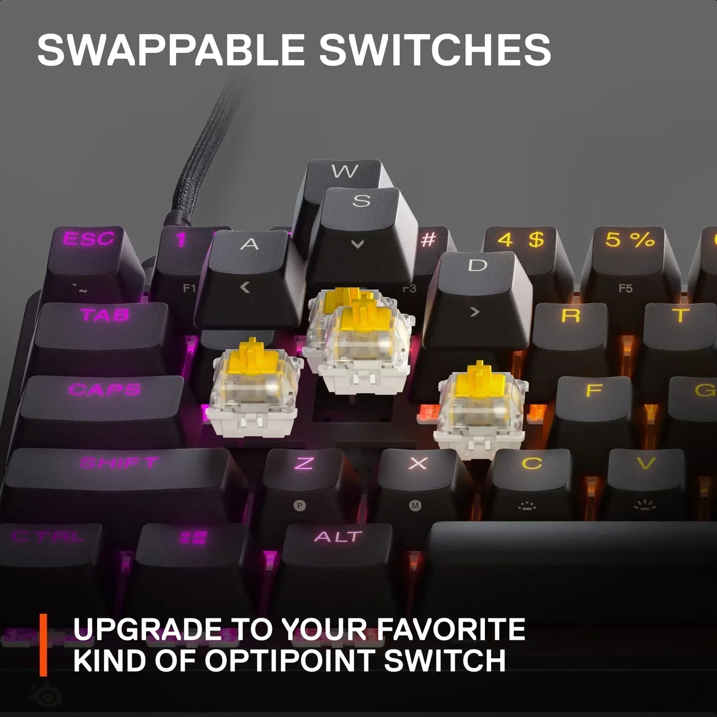 RGB gaming keyboard with swappable yellow OptiPoint switches and illuminated keycaps