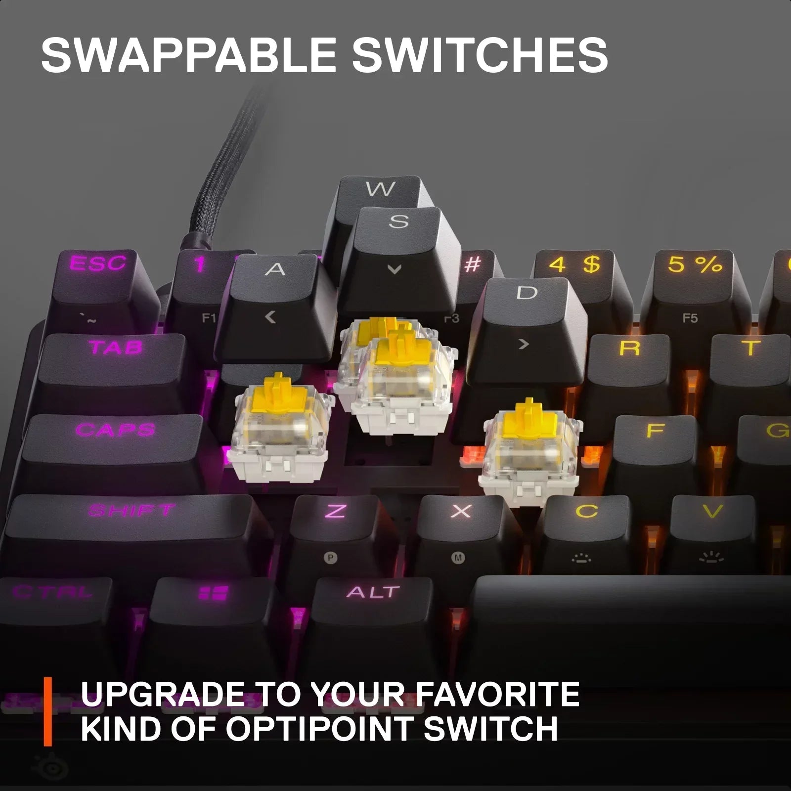 RGB gaming keyboard with swappable yellow OptiPoint switches and illuminated keycaps