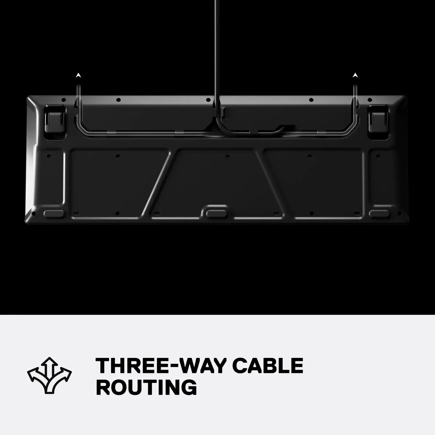 Black gaming keyboard underside showing three-way cable routing, modern desk setup feature