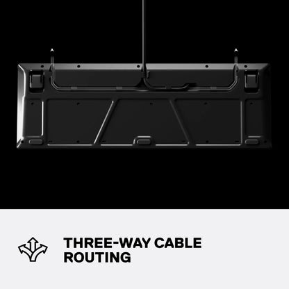 Black gaming keyboard underside showing three-way cable routing, modern desk setup feature