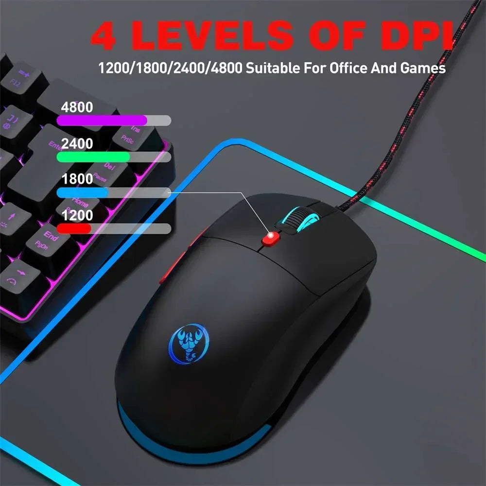 Black wired gaming mouse with blue backlit logo and scroll wheel on RGB mousepad, next to RGB keyboard