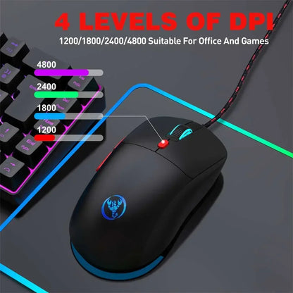 Black wired gaming mouse with blue backlit logo and scroll wheel on RGB mousepad, next to RGB keyboard