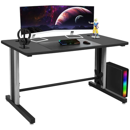 Modern gaming desk setup with dual curved monitors, RGB keyboard, mouse, headphones, and PC tower