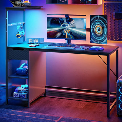 Modern gaming desk setup with curved monitor, RGB keyboard, VR headset, and gaming PC tower