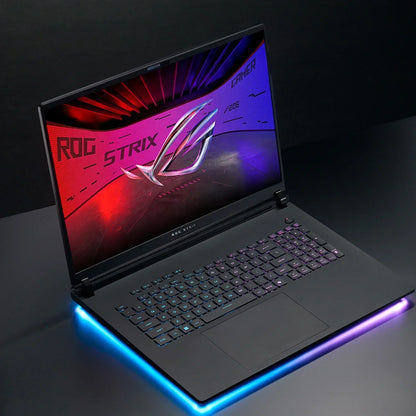 RGB backlit gaming laptop with illuminated keyboard and glowing edge, ROG Strix screen