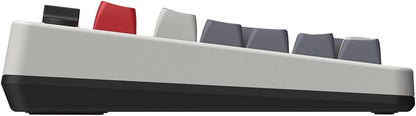 Side view of a retro-style mechanical gaming keyboard with gray, red, and black keycaps