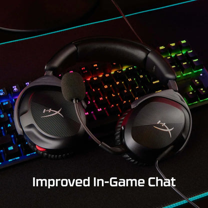 Black HyperX gaming headset with microphone on colorful RGB mechanical keyboard, improved in-game chat