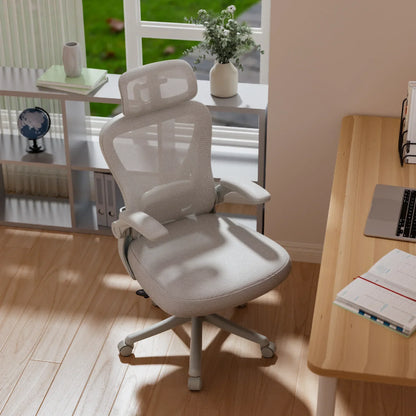 White ergonomic mesh office chair with headrest, adjustable arms, and rolling casters in home workspace