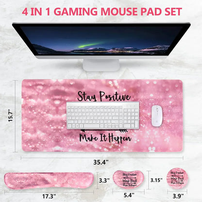 Pink 4-in-1 gaming mouse pad set with motivational quotes, ergonomic wrist rest, keyboard and mouse on marble desk
