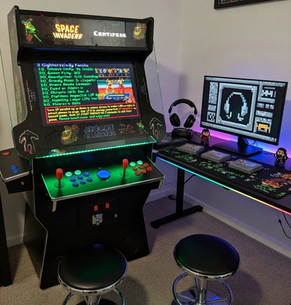 Retro gaming setup with arcade machine, pixel art, gaming PC, and RGB lighting.