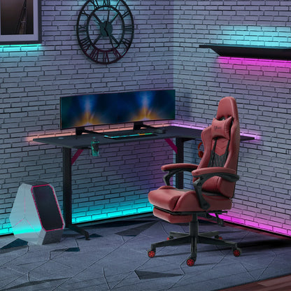 Modern gaming setup with red ergonomic gaming chair, dual monitors on black desk, RGB lighting, and sleek PC tower