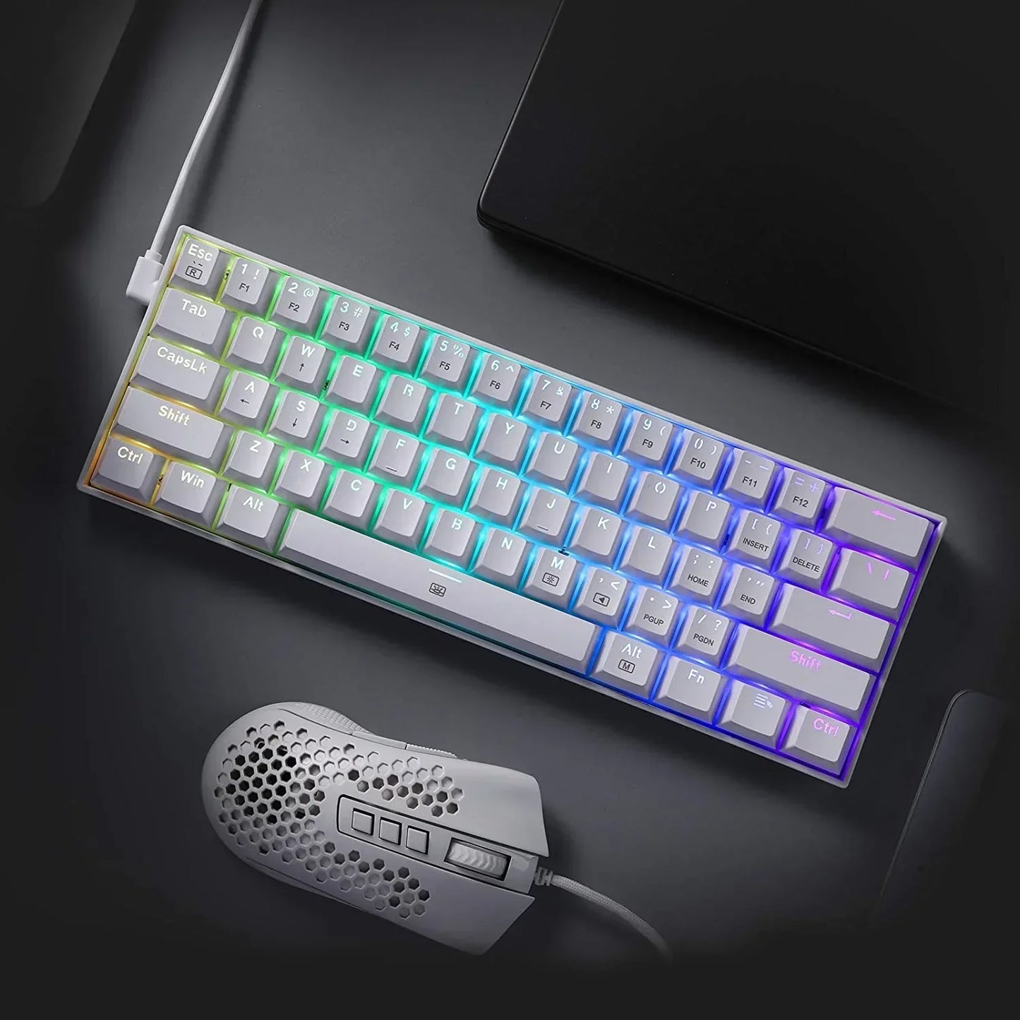 RGB gaming keyboard and lightweight honeycomb mouse on a modern desktop, Byte Style setup