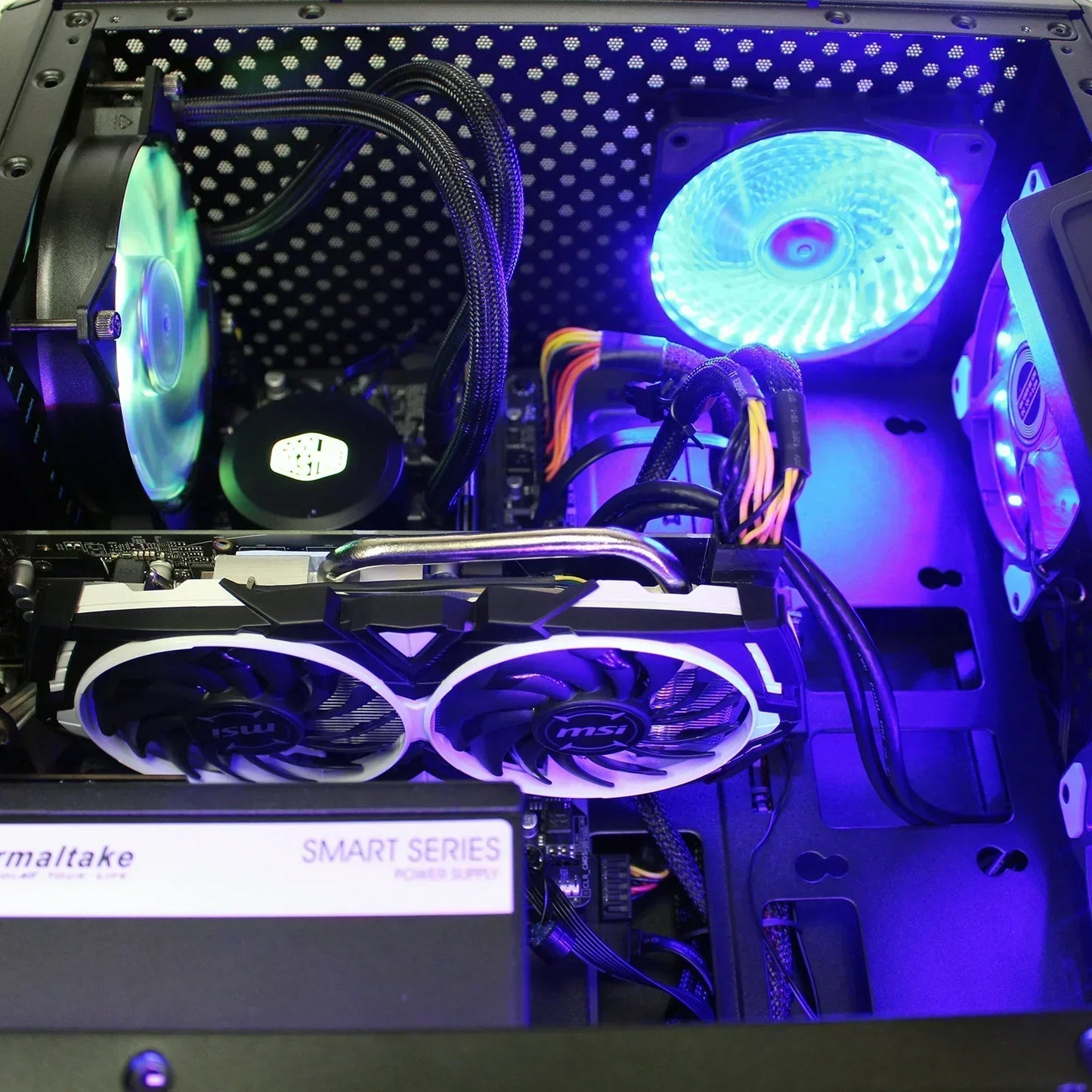 Custom gaming PC interior with RGB cooling fans, MSI graphics card, Thermaltake power supply