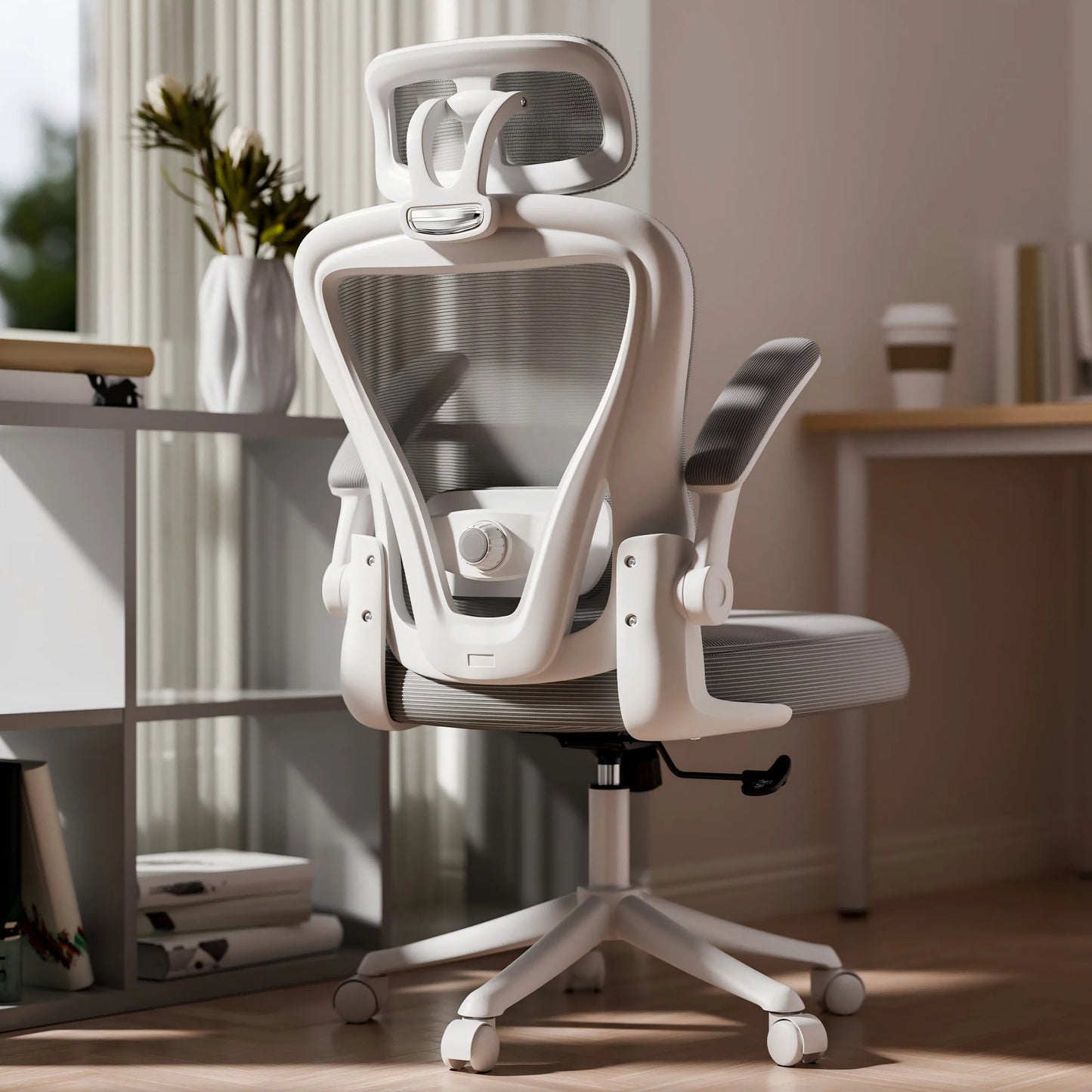 White ergonomic mesh office chair with headrest and adjustable arms in modern home setup