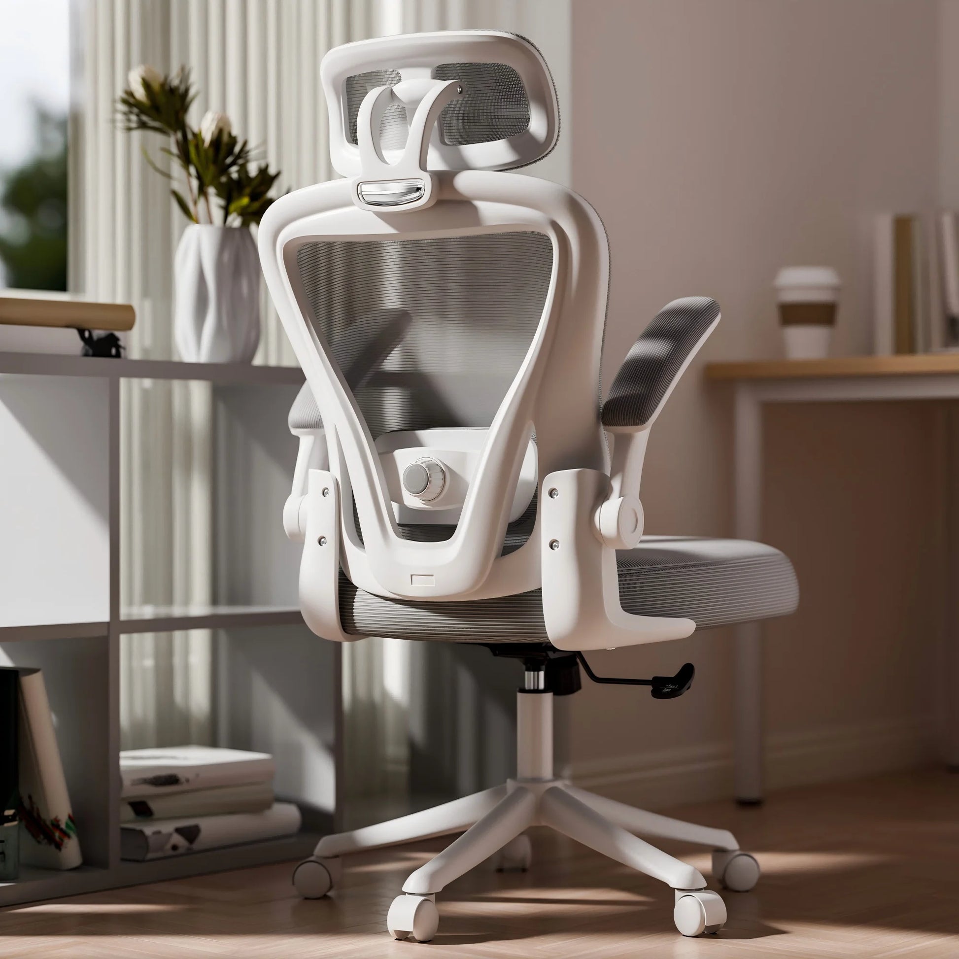 White ergonomic mesh office chair with headrest and adjustable arms in modern home setup