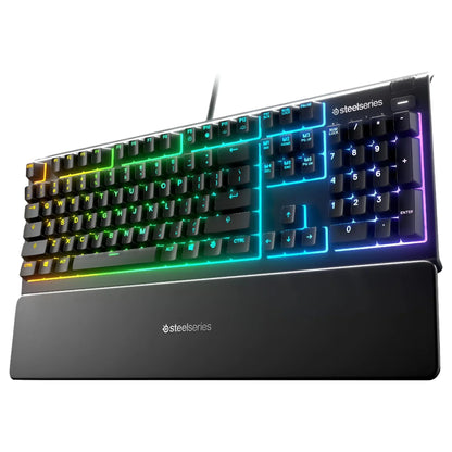 SteelSeries RGB gaming keyboard with numeric keypad and wrist rest on white background