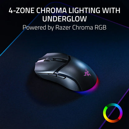 Razer gaming mouse with 4-zone chroma RGB lighting and underglow on dark surface, powered by Razer Chroma