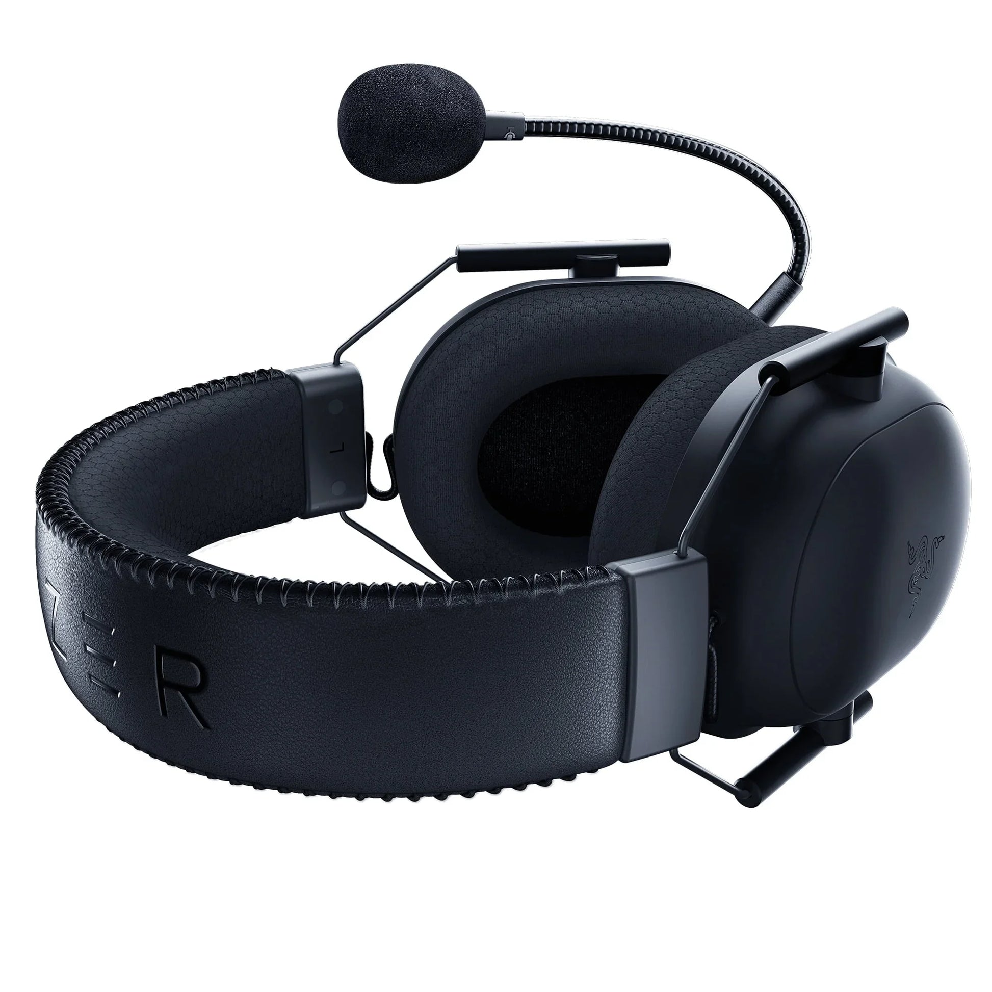Black gaming headset with padded earcups and attached flexible microphone on white background