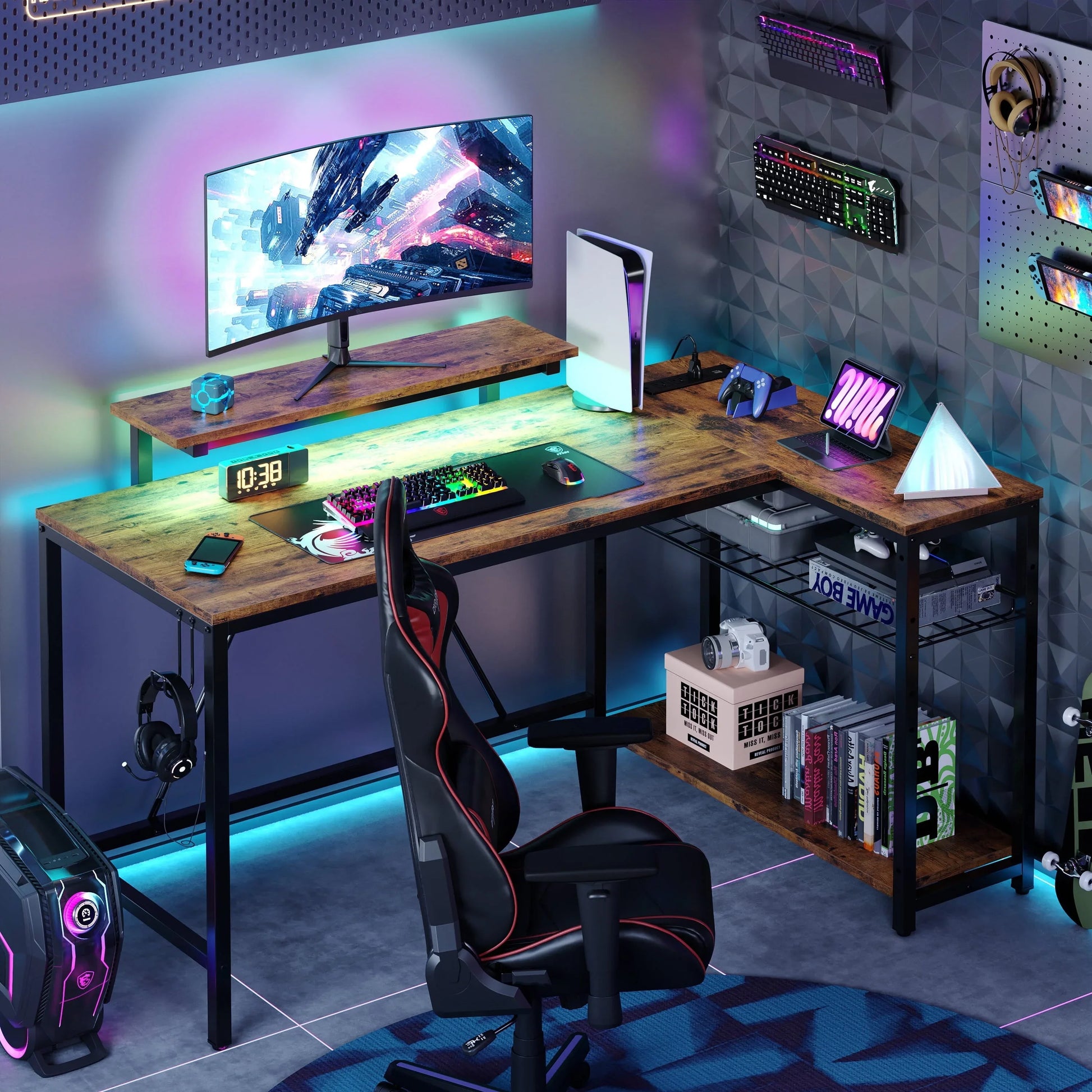 Modern gaming setup with curved monitor, colorful RGB keyboard, PS5, black gaming chair, and wood desk