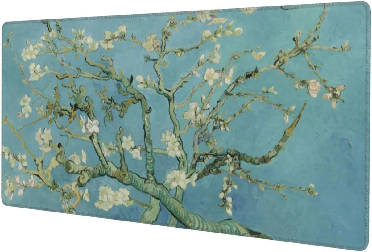 Gaming desk mat featuring detailed almond tree branch artwork with white blossoms on blue background