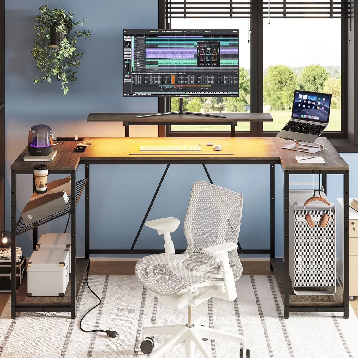 Modern home office setup with wooden desk, white ergonomic chair, laptop on stand, and large monitor with music software