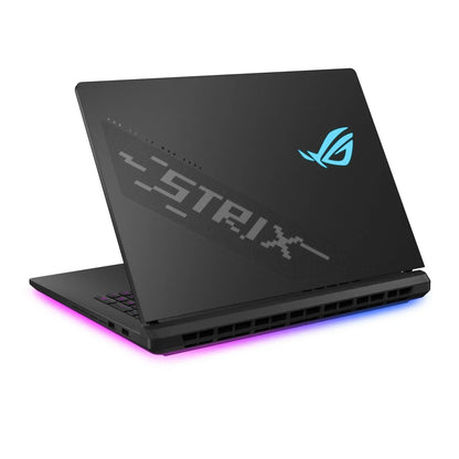 Black gaming laptop with LED backlit keyboard and illuminated ROG logo on lid