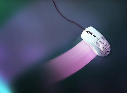 White wired gaming mouse with honeycomb design on dark glowing surface with pink trail effect